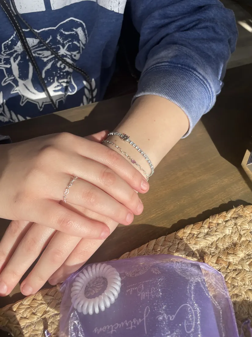 Layered gold bracelets permanent jewelry