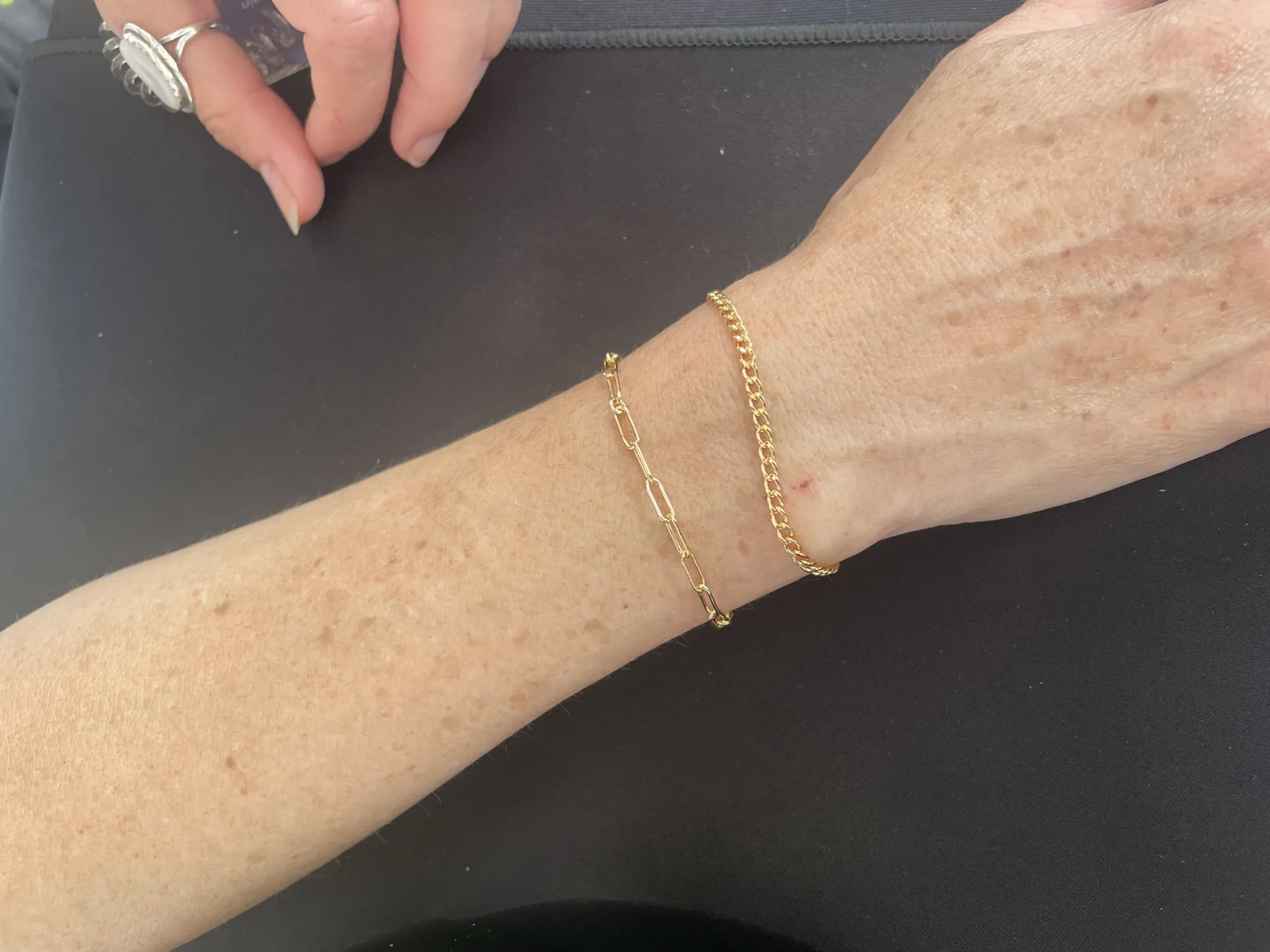 Happy customer showing off new bracelet
